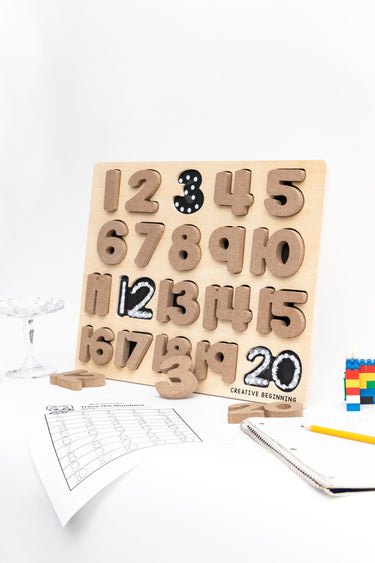 Educational number puzzle set with tactile numbers 0-9 and quantity representations